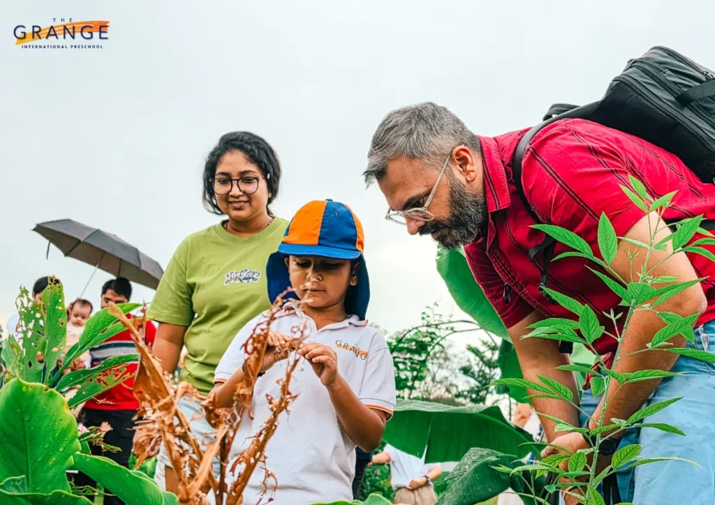 A preschooler exploring plant life at the farm.