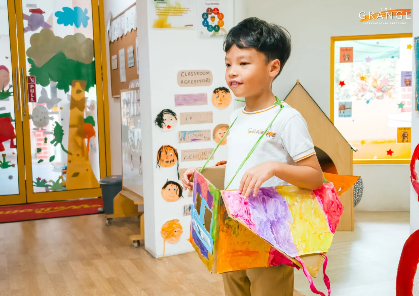 Student presenting his thinking behind the design to classmates, building communication skills and self‑belief through show and tell.